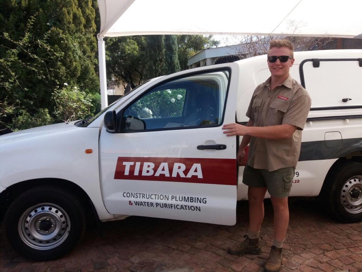 Tibara team member with branded bakkie